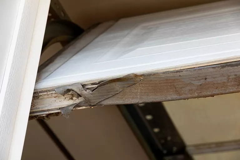 Deterioration of garage door weatherstripping.