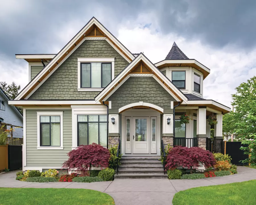 The front exterior of a home with large windows