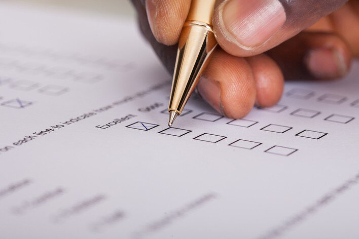 A man filling out a survey