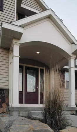 Home features a door with a 3/4 lite, 1-panel door style, 2 sidelites and regency glass, prefinished in Symphony 