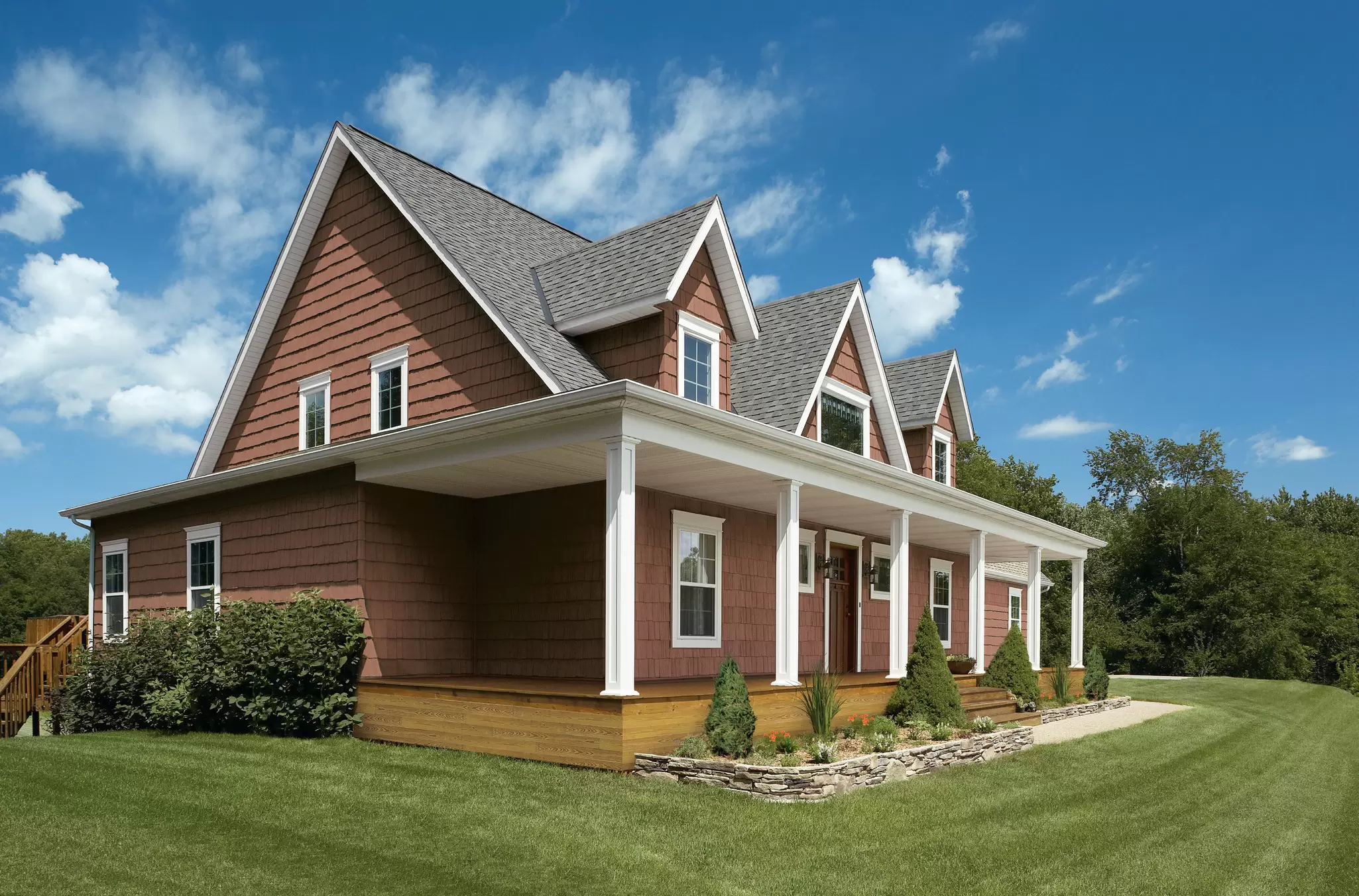 Two-story home with a dark-red exterior.