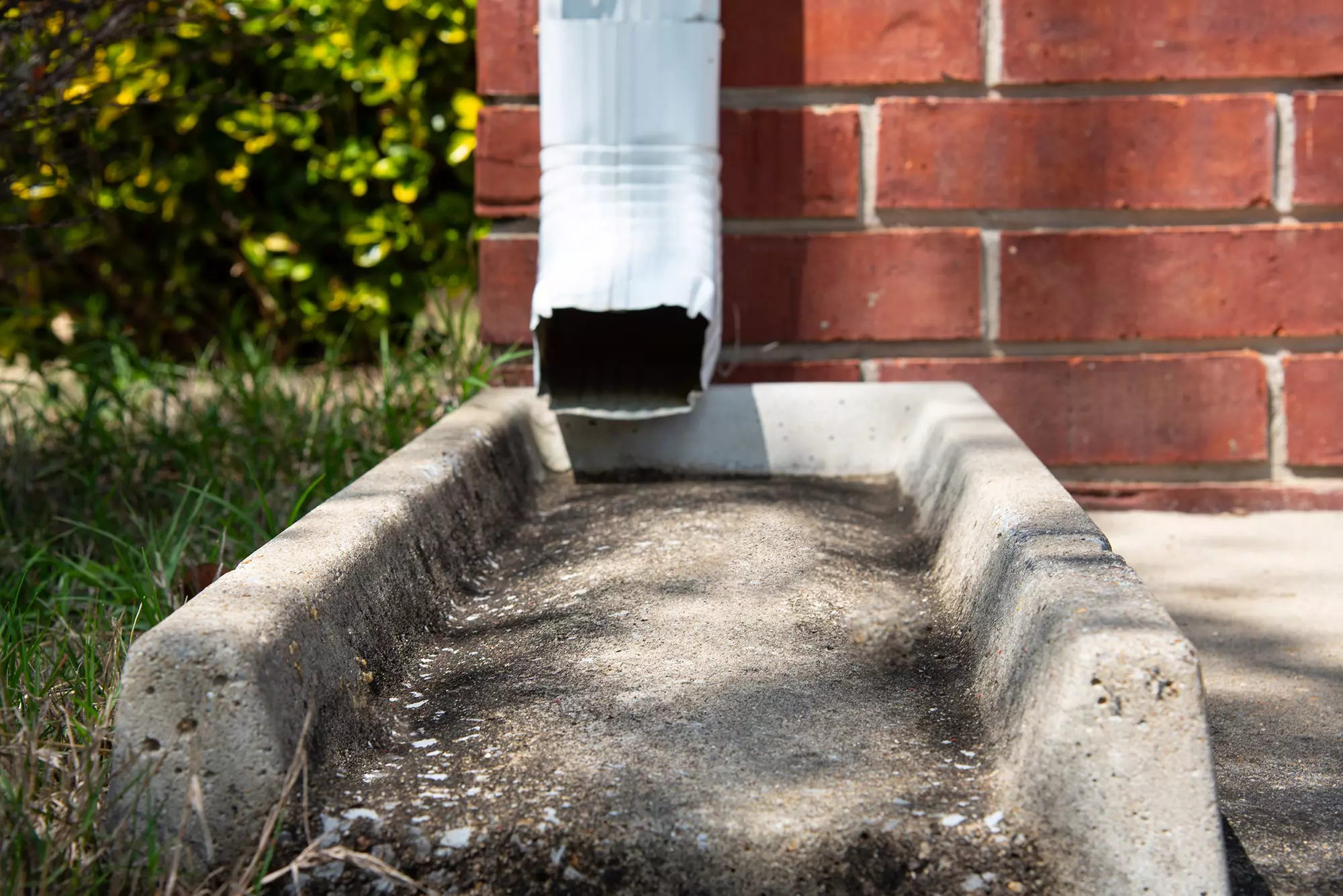 The downspout of a gutter that is clean and able to funnel water correctly.