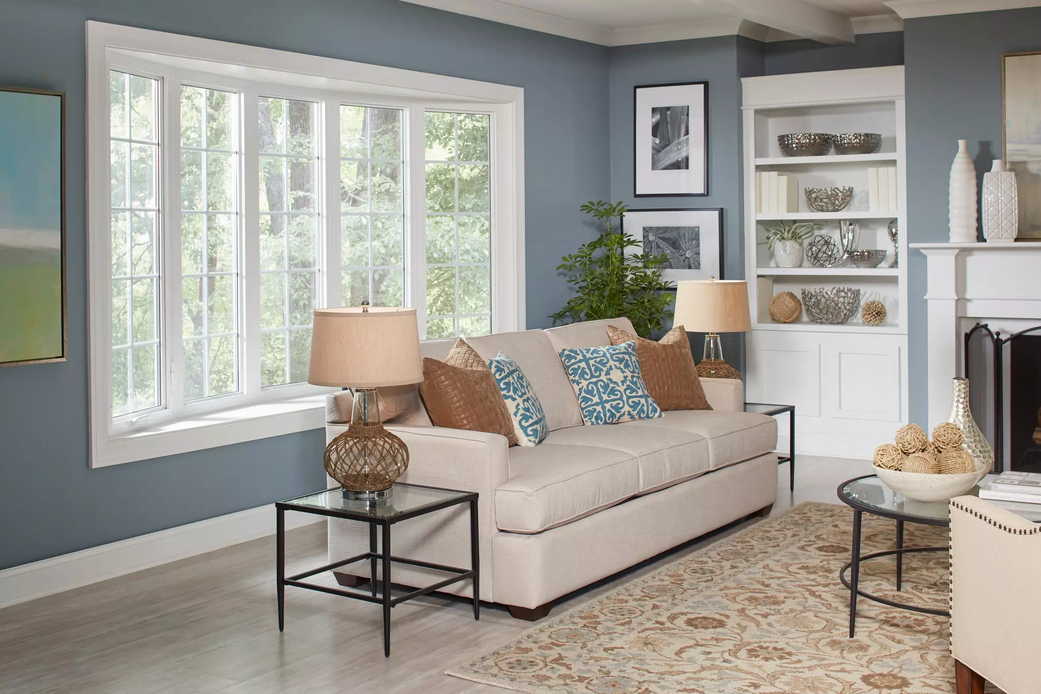 Living room interior with a white bow window.