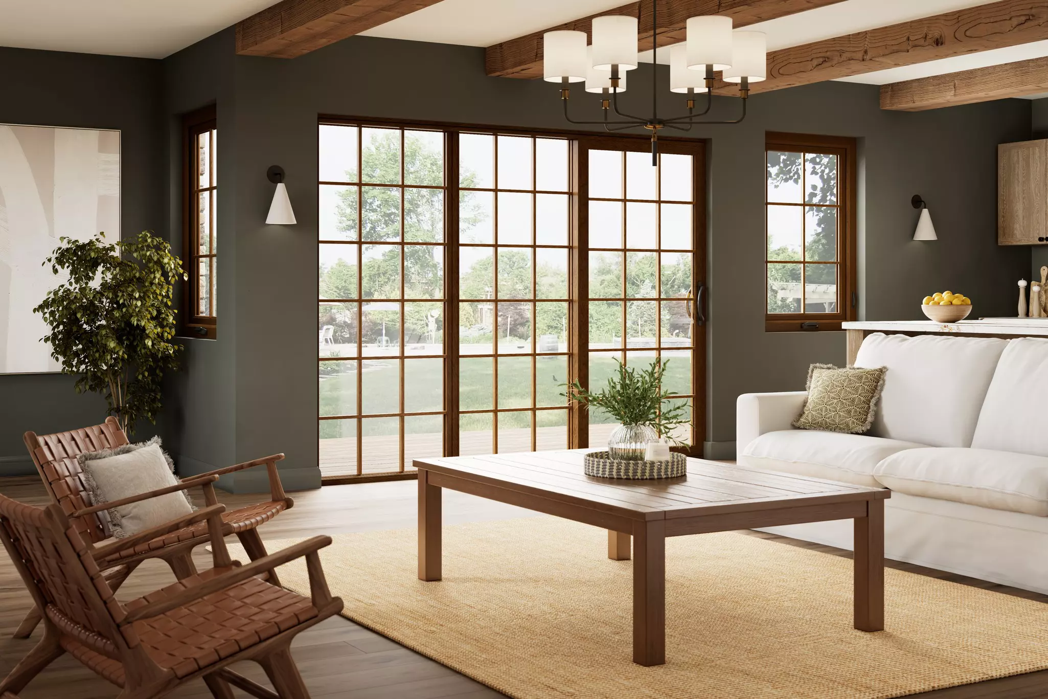 Living room of a home with a patio door and windows with grids.