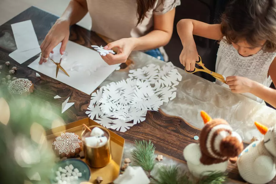 A mom and her daughter enjoying an indoor winter activity for families 