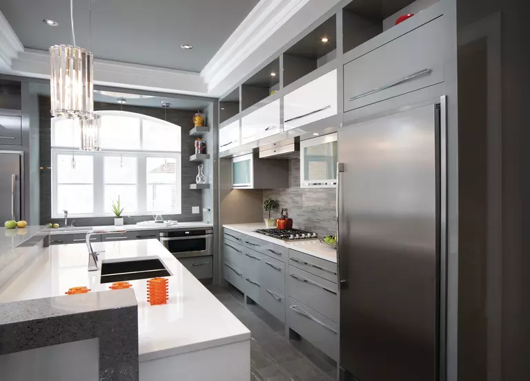 A specialty shaped window in a kitchen, used to compliment the style of the room.