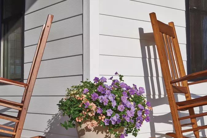 Close-up of ASCEND Composite Cladding, 4" corner post on a modern farmhouse