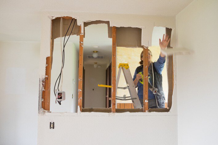 A woman remodels her ranch home by removing walls