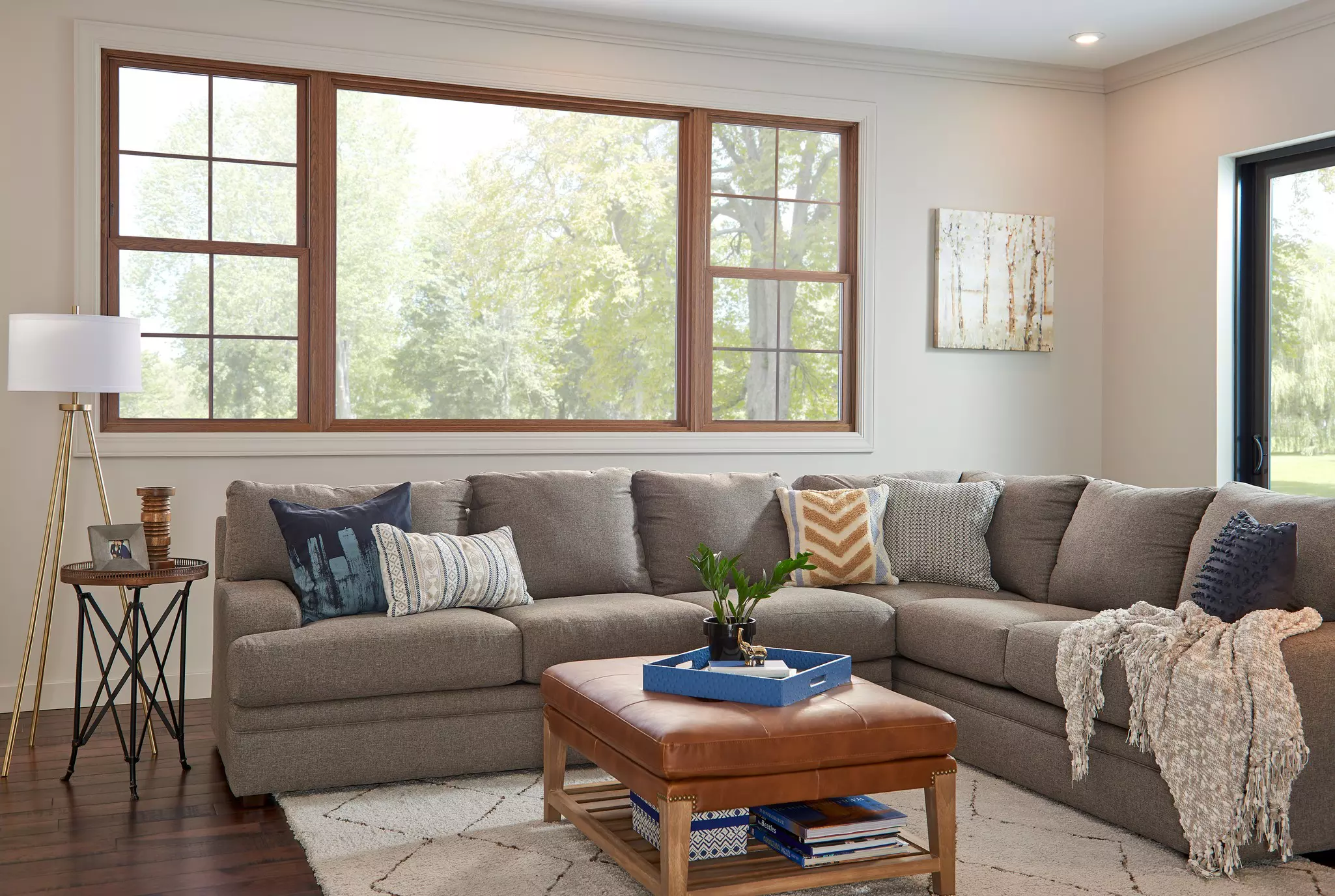 Living room with a large window and sliding patio door.