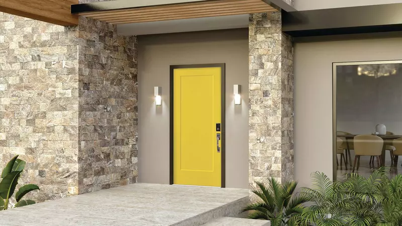 Yellow smooth entry door on a modern home