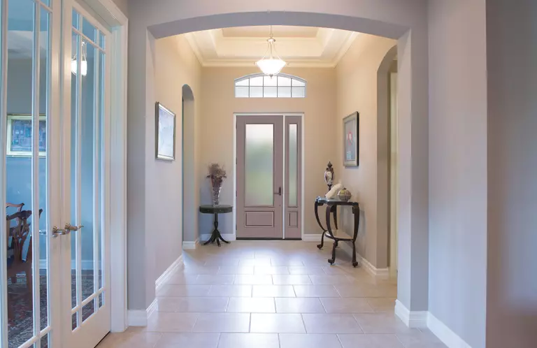 Contemporary white front door with one 3/4ths sidelite.