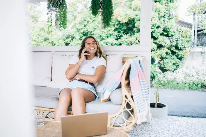 Woman talking on porch