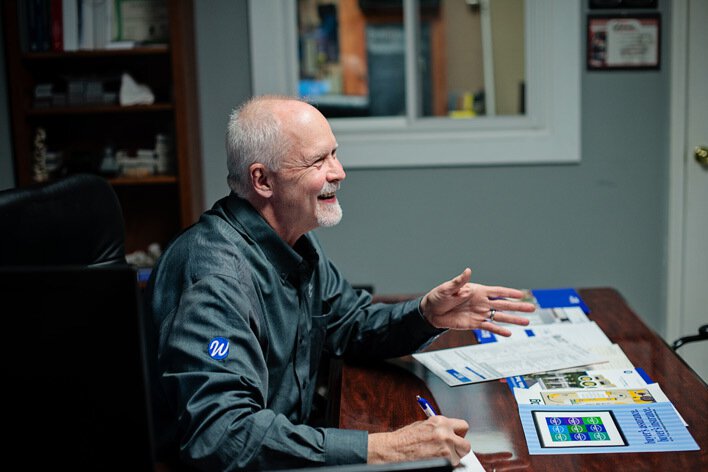 A Window World employee talking with customers about beginning a home remodeling project