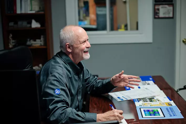A Window World employee talking with customers about beginning a home remodeling project