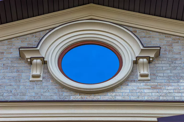 A circular window, one of the common specialty architectural shapes for windows.