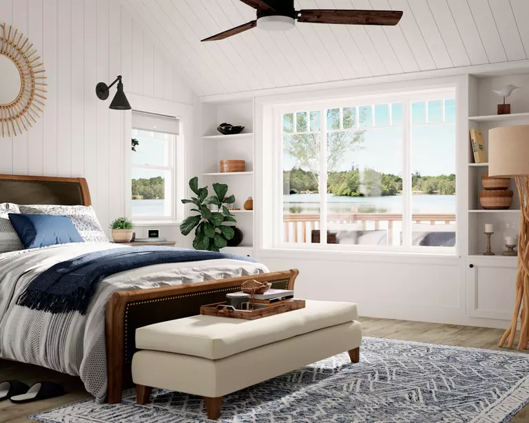 Bedroom with a combination of double-hung and sliding windows.