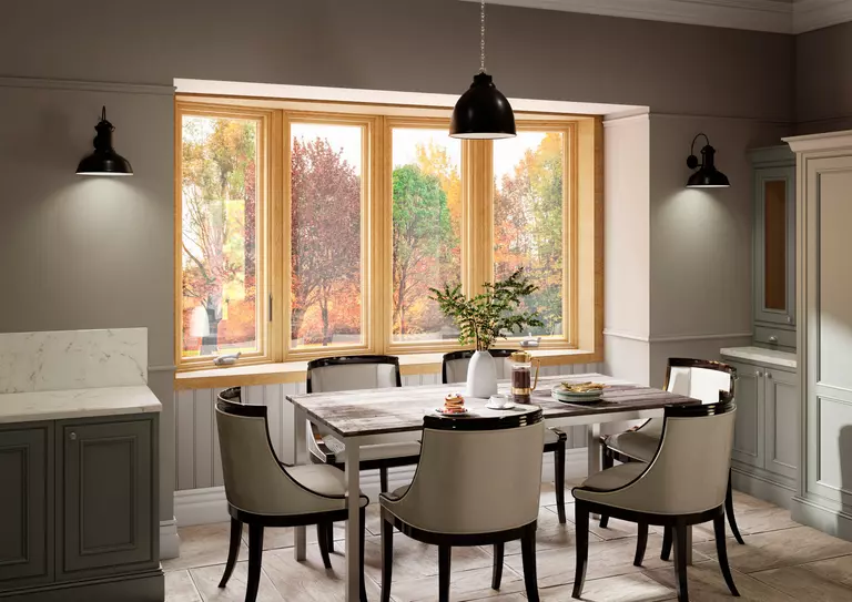 Gray, modern dining room with energy-efficient bow windows.