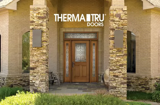 Home with a woodgrain Therma-tru entry door sold by Window World of Southern Colorado