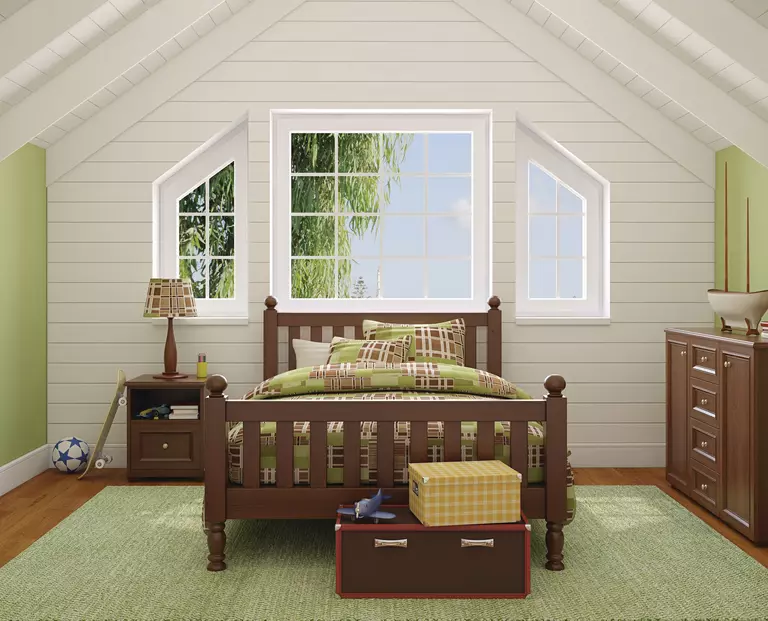 Green bedroom featuring energy-efficient windows.