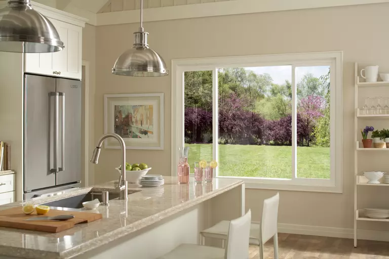 Home kitchen with a sliding window.