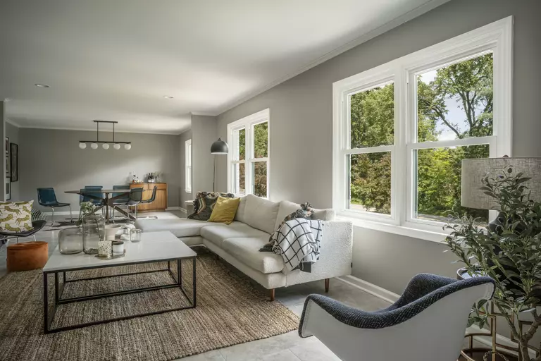 The living room of a home with new white windows.