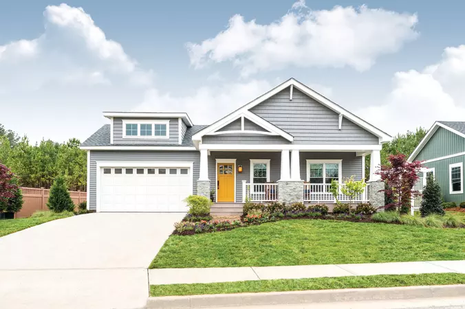 White short panel garage door with clear windows on a contemporary home