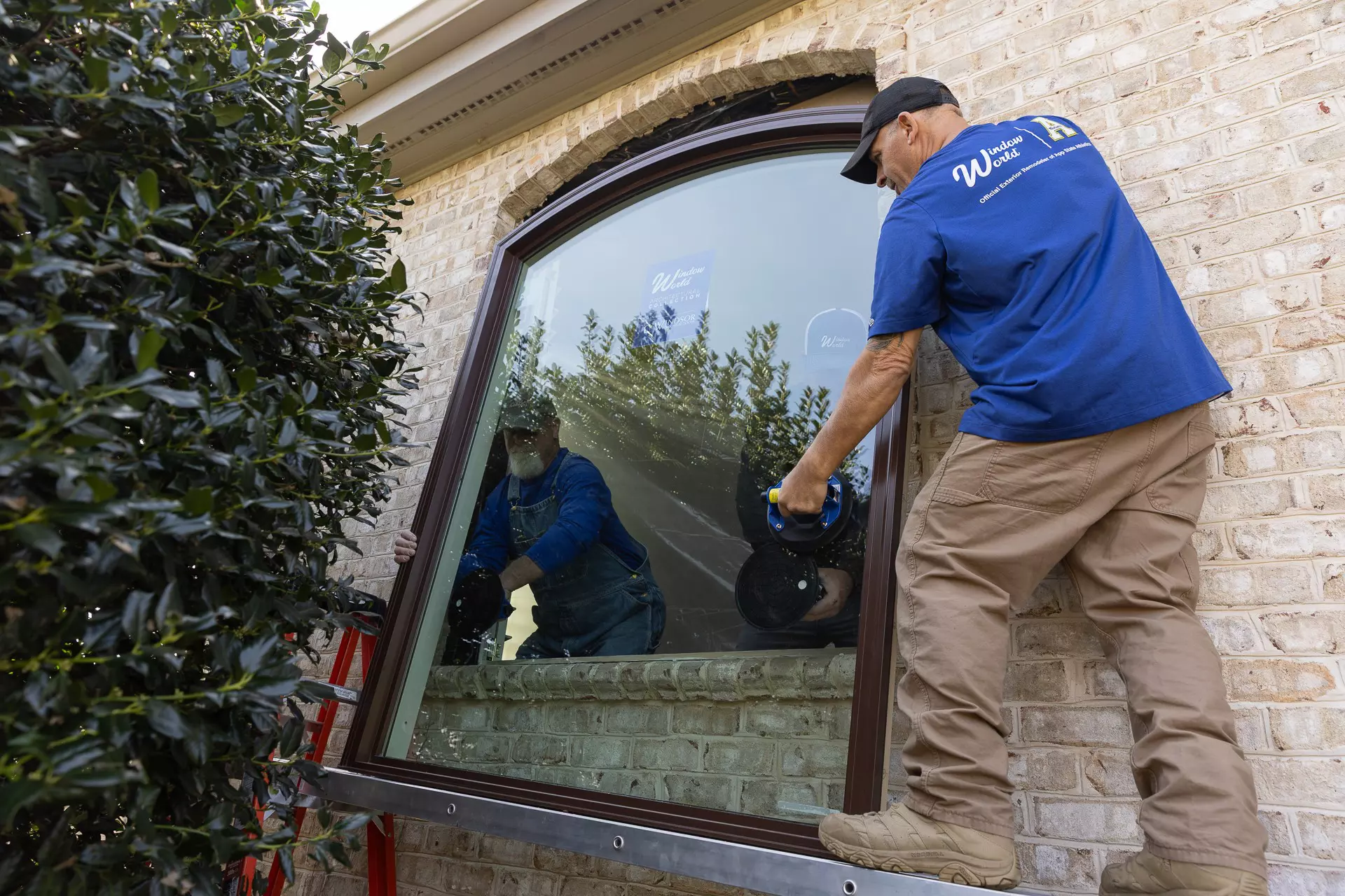 Window World worker installing a new window.