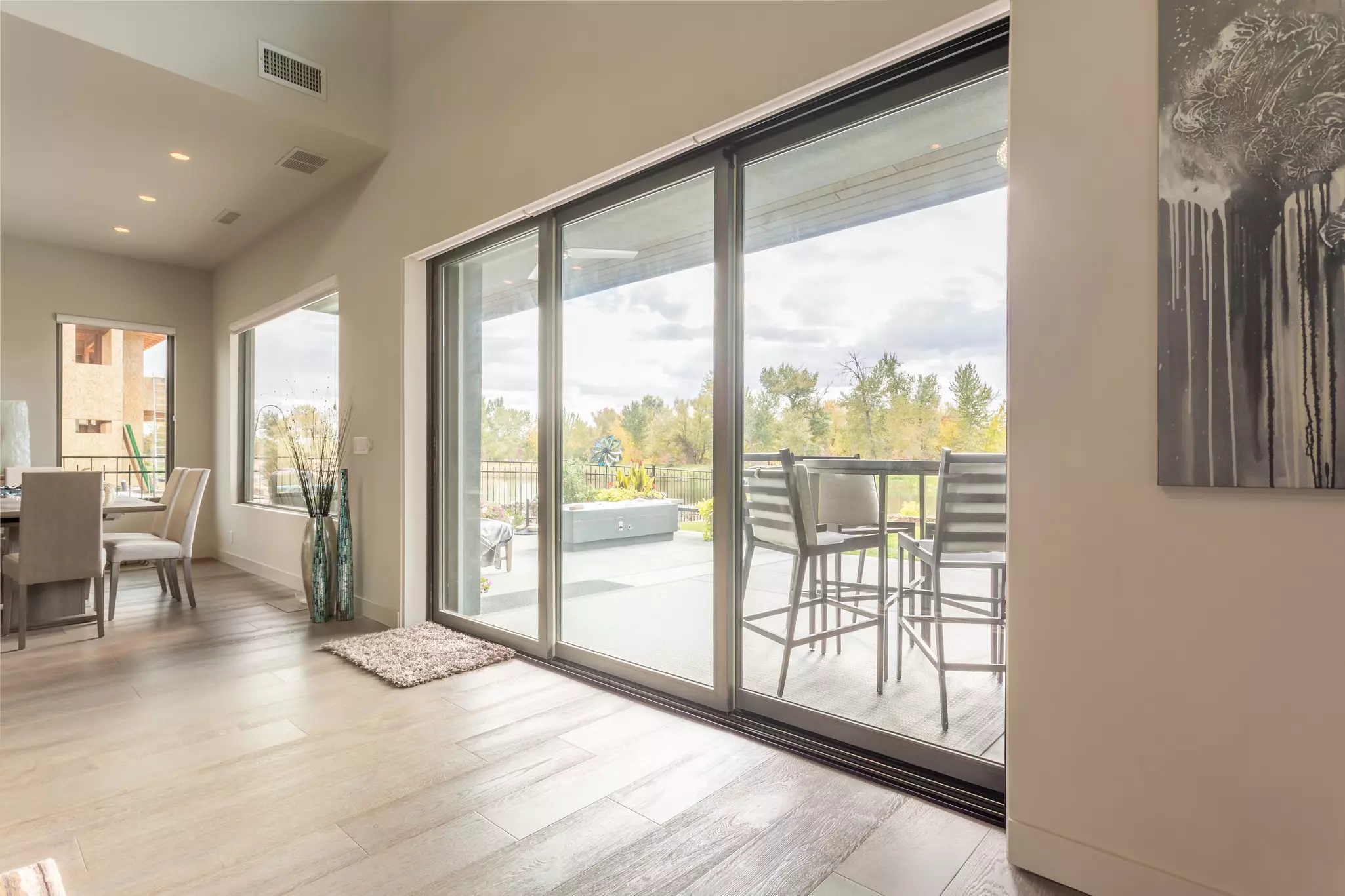 Sliding glass patio door with three panels.