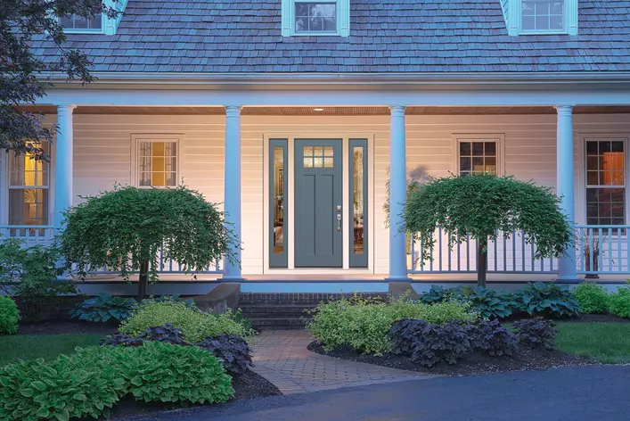 A large house with a light blue energy-efficient door