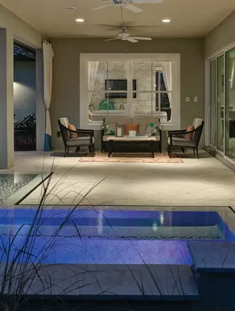 Window World 8500 Aluminum series white windows under a porch with a small pool area.