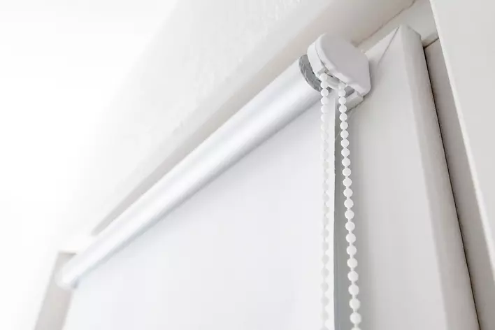 Roller shades as patio door window treatments