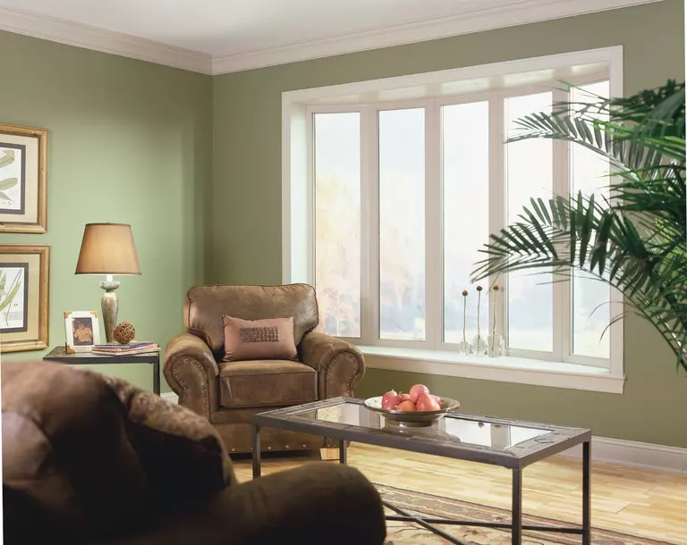 A living room with a bay window.