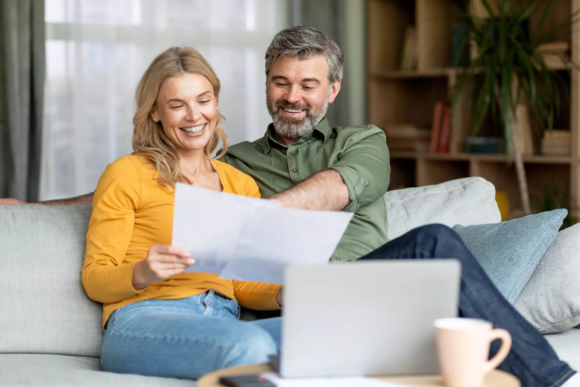 Homeowners reviewing energy performance ratings while choosing a new front door.