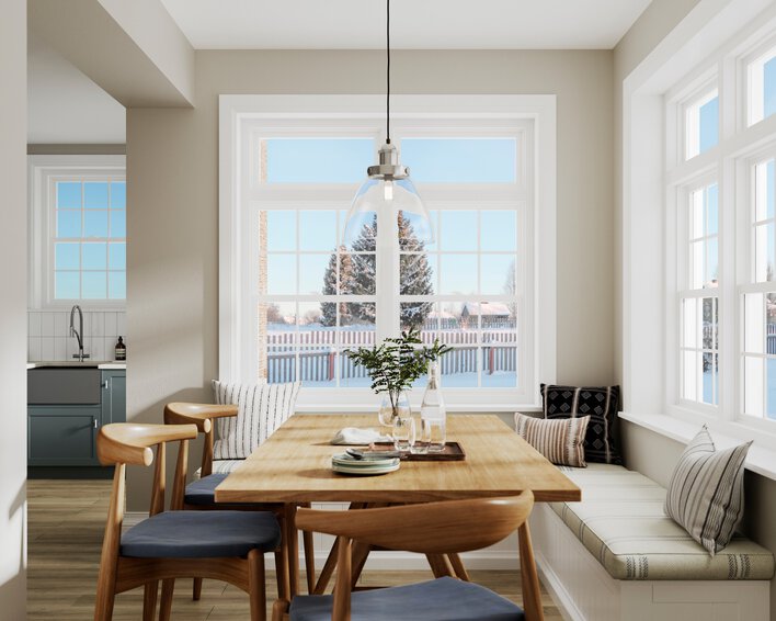 Energy-efficient vinyl window material keeps a breakfast nook cozy while looking out on a wintry landscape.