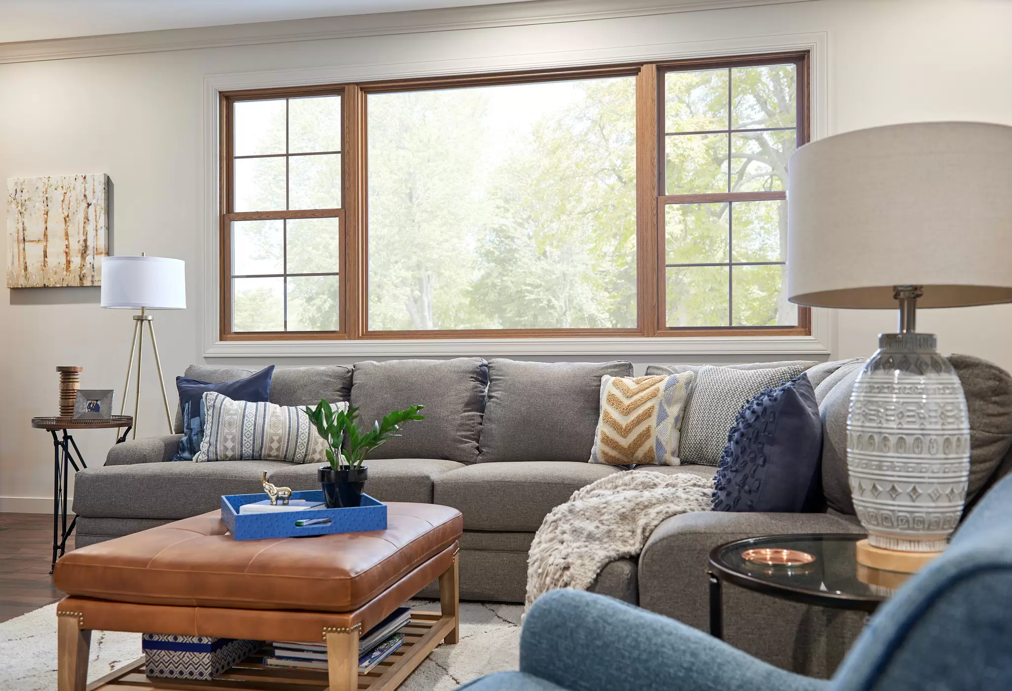 A large picture window above a couch.