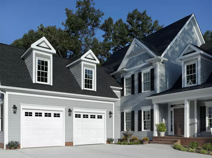 Exterior view of a home with two garage doors