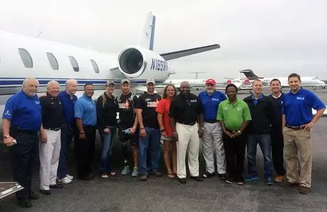 Greg Deathridge with Veterans outside of the VAC jet