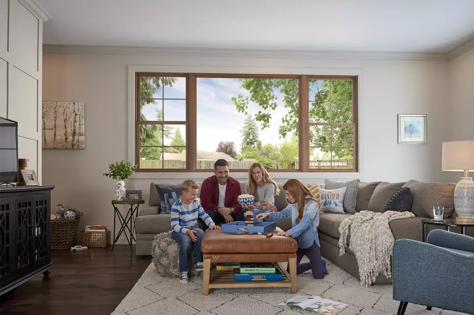 Family playing games together in living room
