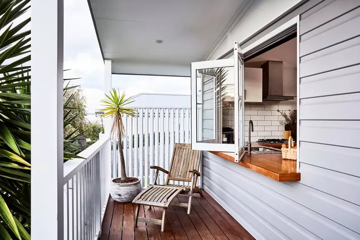 Deck with windows that open to kitchen