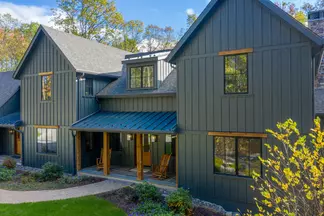 Large 2-story ranch home with hardie plank, shingle, panel, soffit and trim in Aged Pewter and Artic White