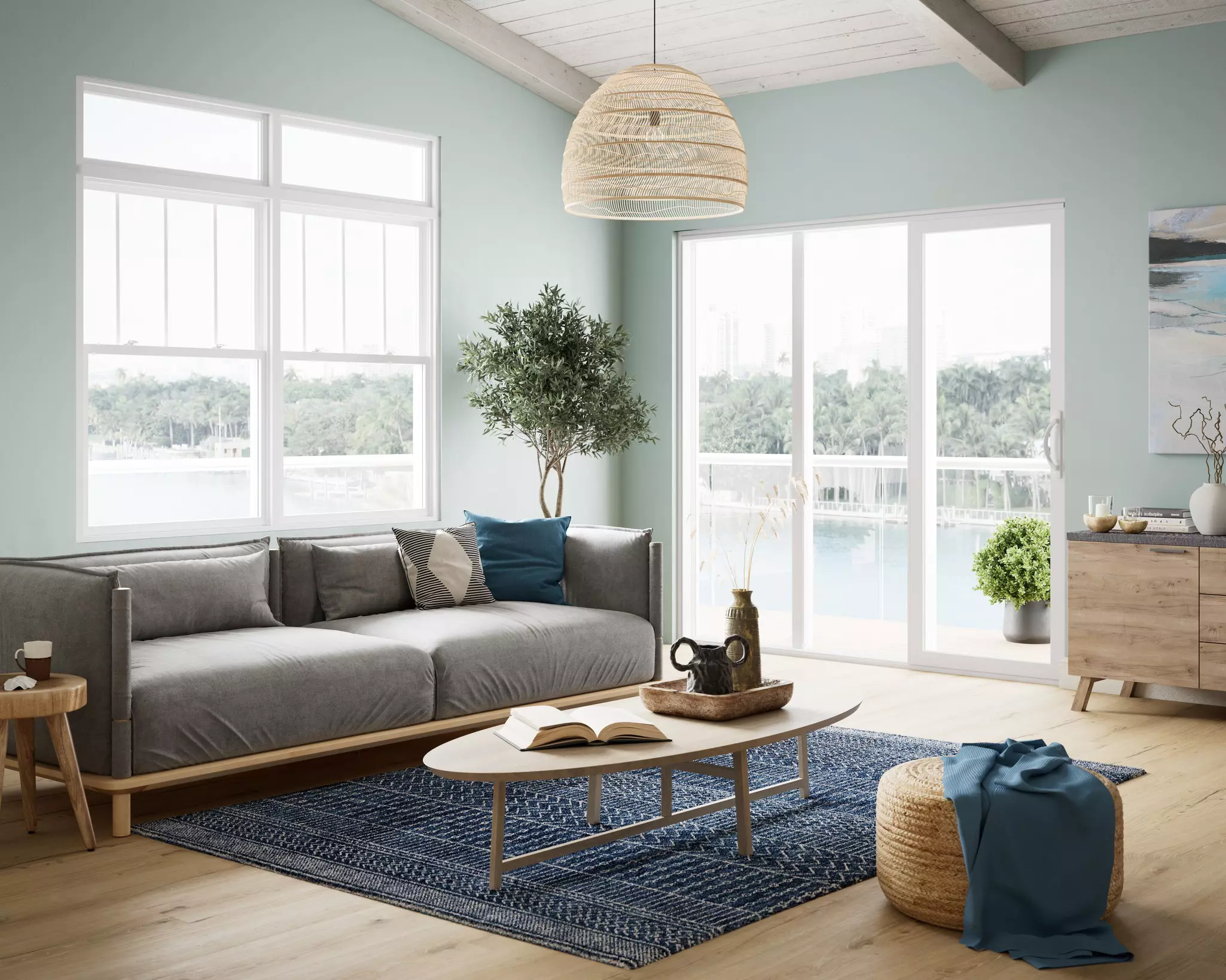 Living room of a home near a body of water with a sliding patio door.