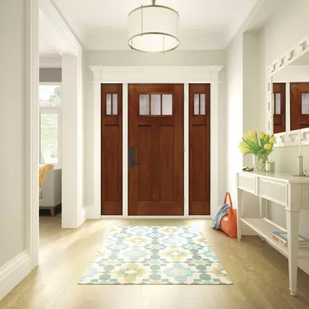 Premium Textured Fiberglass door in Fir, with a Balwin handleset in venetian bronze