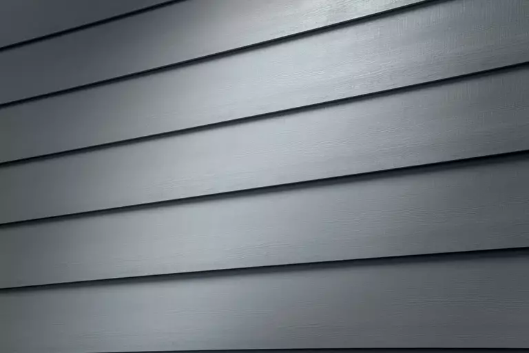 Up close view of composite siding and an example of one of the many different colors and aesthetic styles the exterior material can come in.