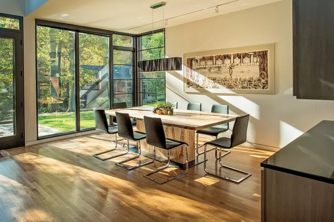 Black wood-clad direct set & radius windows in a modern styled dinning room
