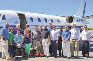 Window World of Fresno store owner Greg Deathridge with Veterans outside of the VAC jet