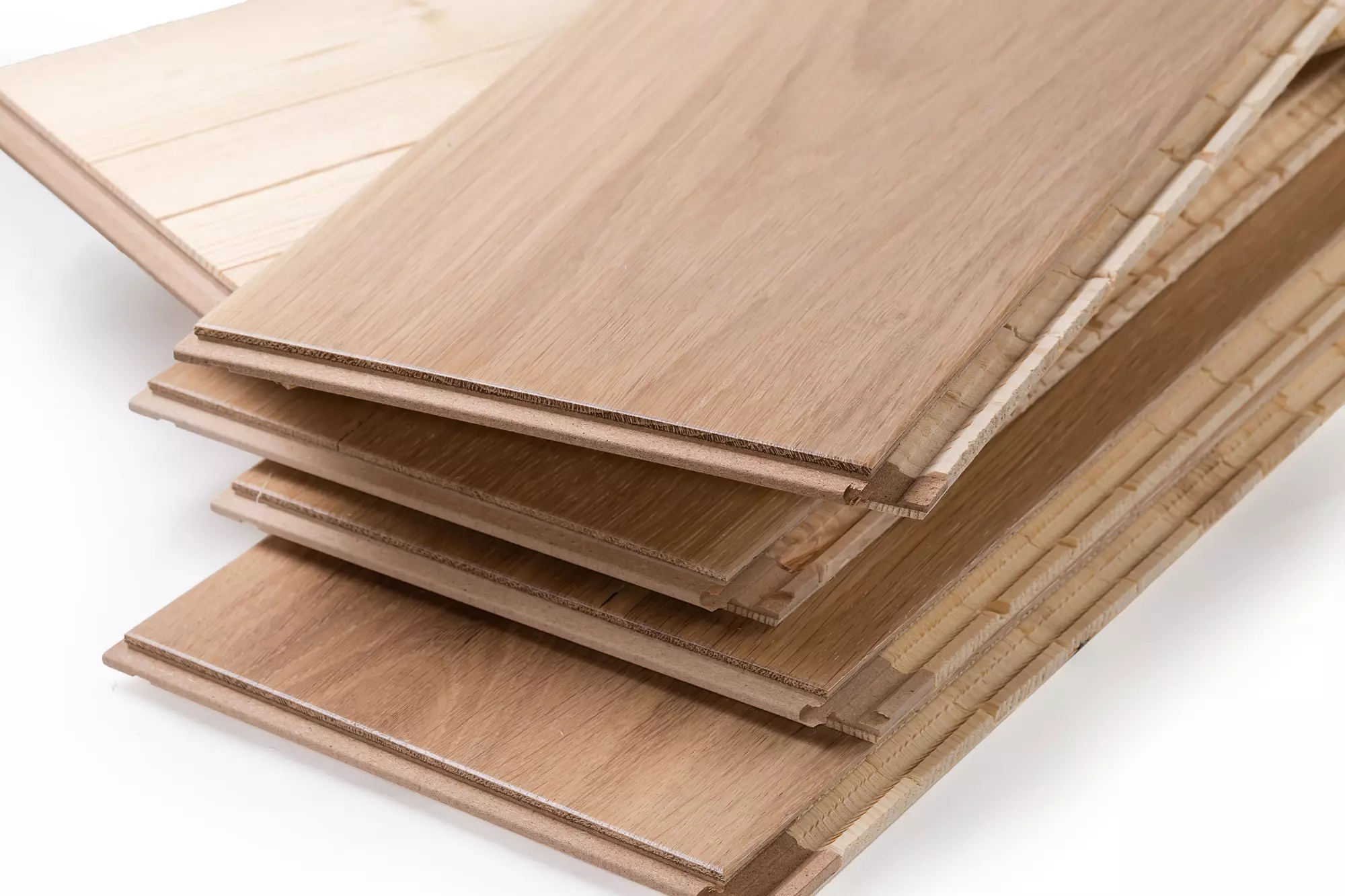 Close-up of oak engineered wood boards in a stack.