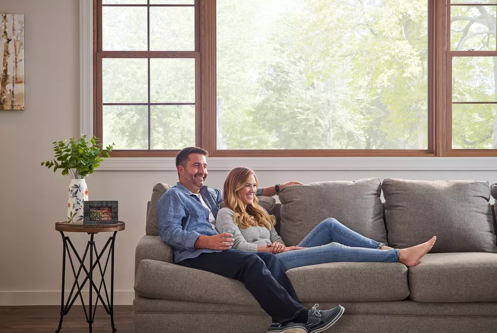 Couple enjoying sunlight in front of Window World windows