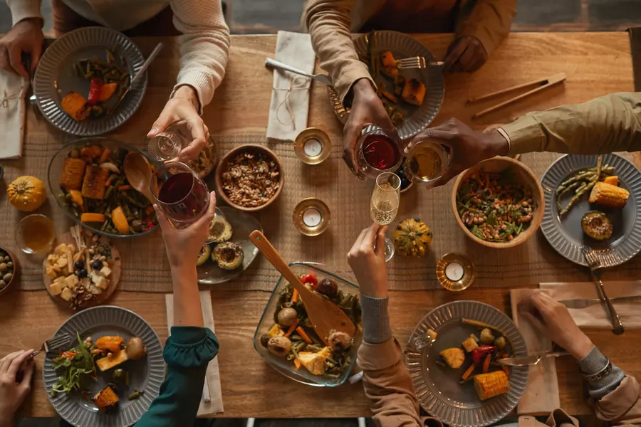 People gathered around a table enjoying a holiday feast