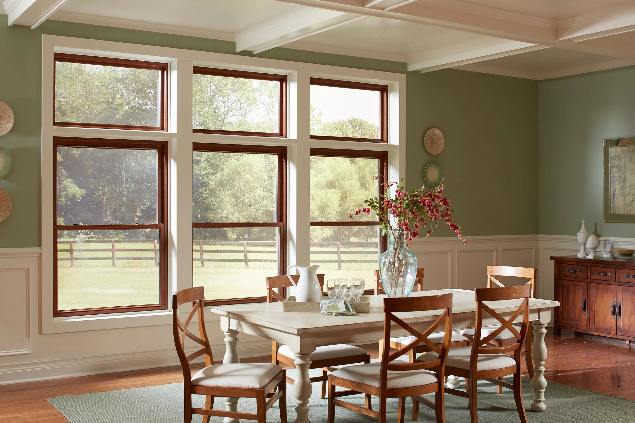 Dining room featuring a combination of double-hung and transom windows.