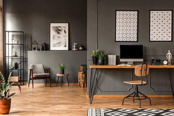 Wooden home office desk in a gray apartment